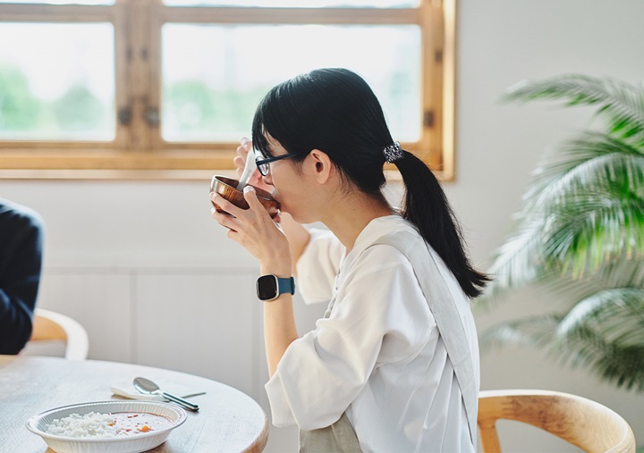 Ai Sato eating miso soup with an Electric Salt Spoon.